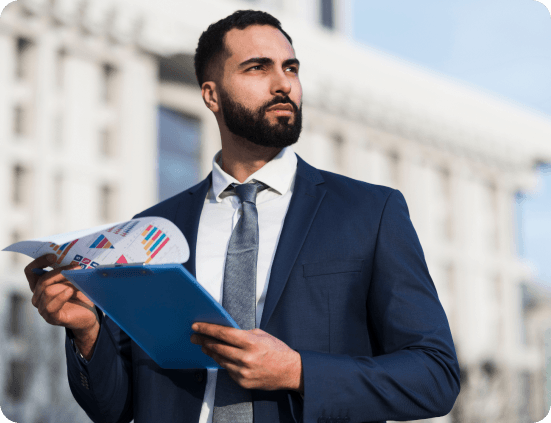 Professional businessman in suit holding documents