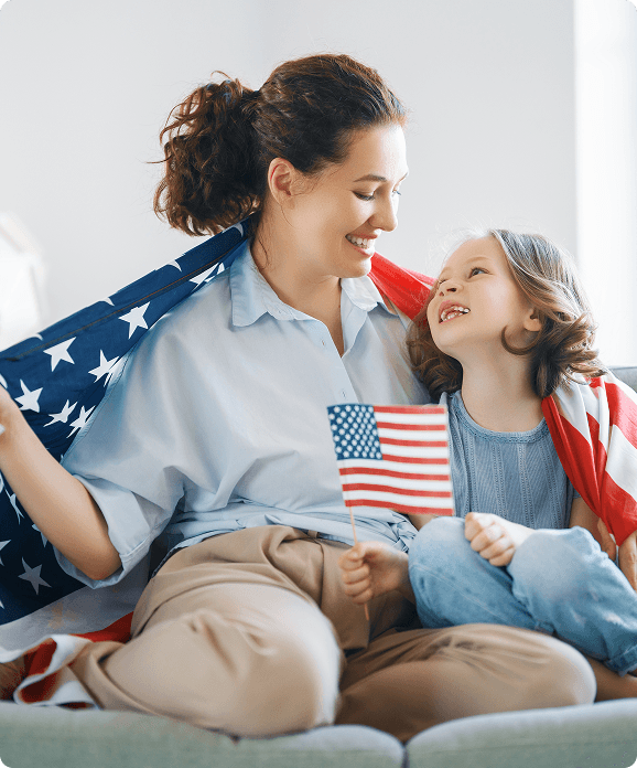 Mother and daughter with American flag